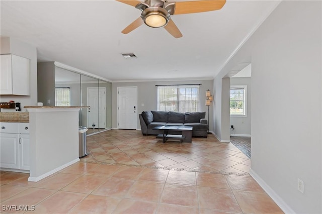 3018 Sunset Rd, Fort Myers, FL 33901 - living area featuring ornamental molding, ceiling fan, and light tile patterned flooring