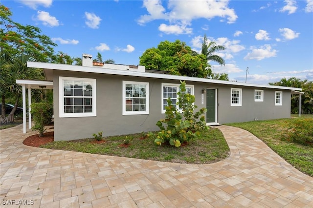 3018 Sunset Rd, Fort Myers, FL 33901 - single story home featuring stucco siding and a chimney