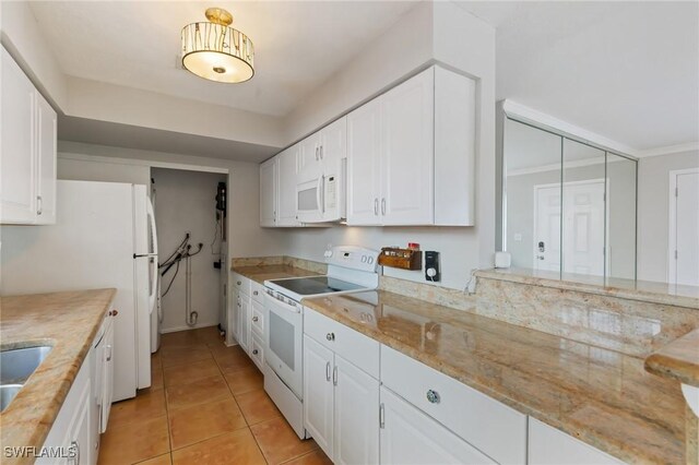 3018 Sunset Rd, Fort Myers, FL 33901 - kitchen featuring white appliances, white cabinetry, light tile patterned floors, and light stone counters