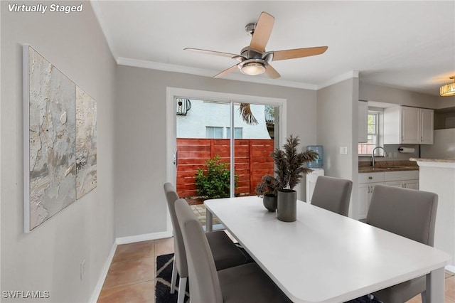 3018 Sunset Rd, Fort Myers, FL 33901 - dining space featuring a ceiling fan, crown molding, and light tile patterned floors