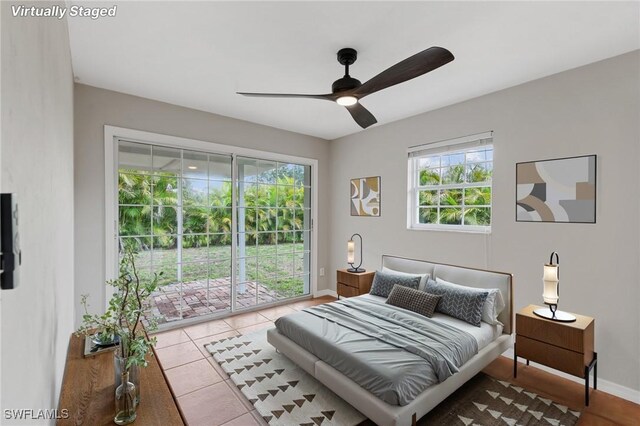 3018 Sunset Rd, Fort Myers, FL 33901 - tiled bedroom featuring access to exterior and ceiling fan