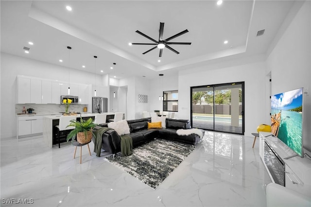 1921 SW 4th St, Cape Coral, FL 33991 - living area with a raised ceiling, light marble finish flooring, recessed lighting, and ceiling fan