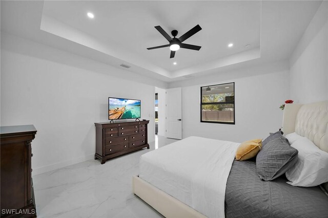 1921 SW 4th St, Cape Coral, FL 33991 - bedroom with a raised ceiling, recessed lighting, baseboards, light marble finish floors, and a ceiling fan