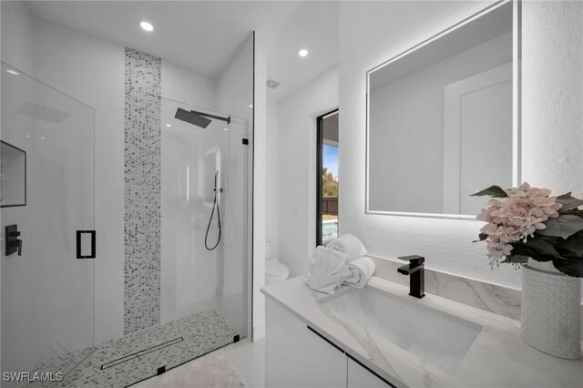 1921 SW 4th St, Cape Coral, FL 33991 - bathroom featuring a stall shower, vanity, toilet, and recessed lighting