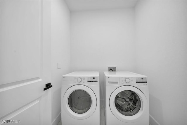 1921 SW 4th St, Cape Coral, FL 33991 - laundry area with separate washer and dryer and baseboards