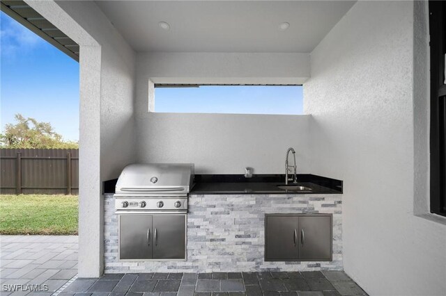 1921 SW 4th St, Cape Coral, FL 33991 - view of patio / terrace featuring a sink