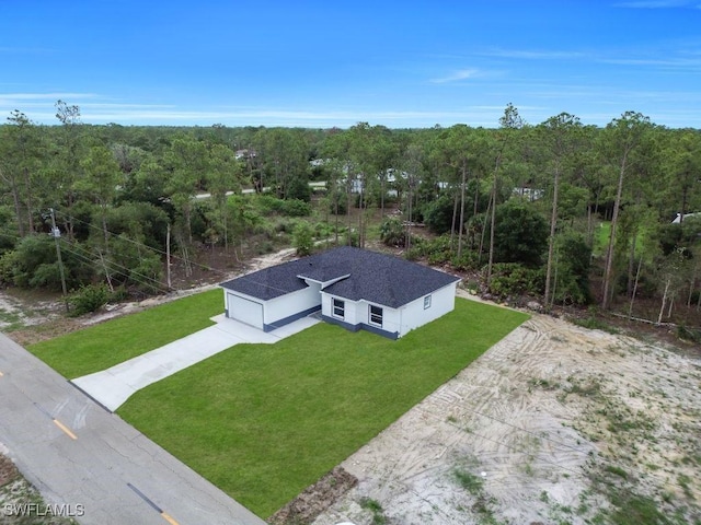 1205 W 14th St, Lehigh Acres, FL 33972 - aerial view of property and surrounding area featuring a forest
