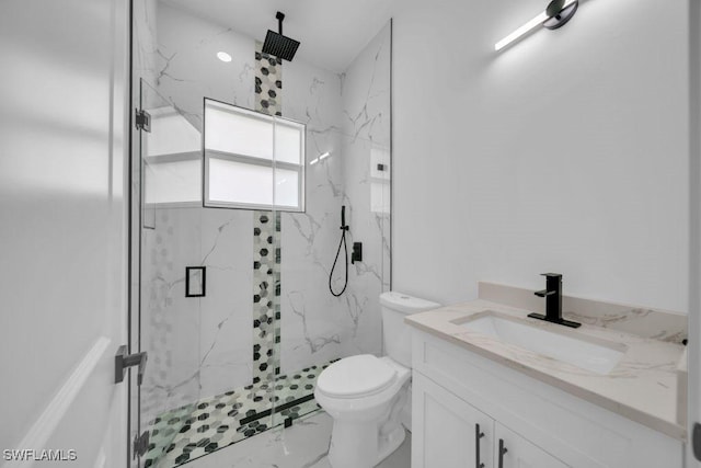 1205 W 14th St, Lehigh Acres, FL 33972 - bathroom featuring a marble finish shower, marble finish flooring, vanity, and toilet