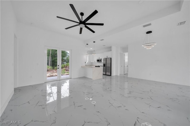 1205 W 14th St, Lehigh Acres, FL 33972 - unfurnished living room featuring light marble finish flooring, french doors, and a ceiling fan