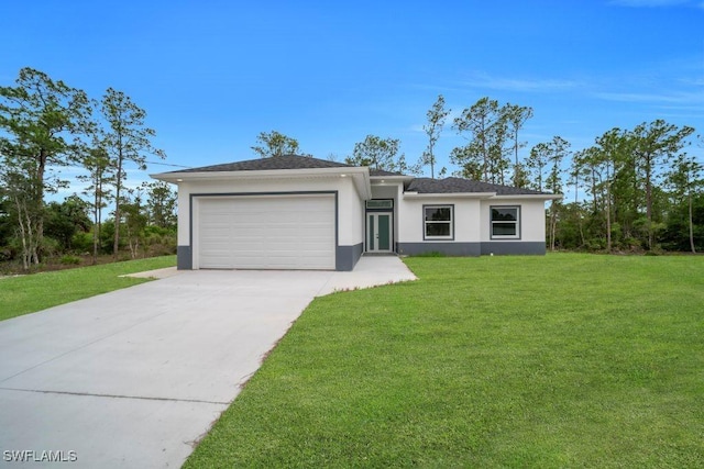 1205 W 14th St, Lehigh Acres, FL 33972 - view of front of house with an attached garage, concrete driveway, stucco siding, and a front yard