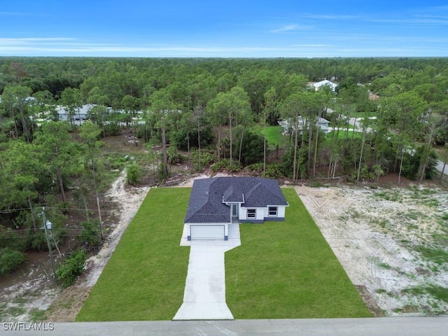 1205 W 14th St, Lehigh Acres, FL 33972 - aerial view of property and surrounding area with a heavily wooded area