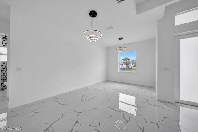 1205 W 14th St, Lehigh Acres, FL 33972 - unfurnished dining area with marble finish floors and baseboards