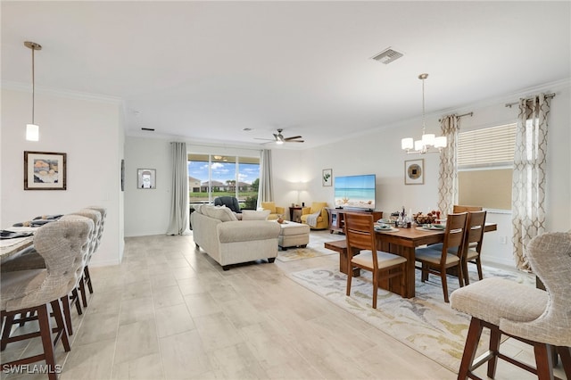16126 Rosemallow Ln, Alva, FL 33920 - dining room featuring a ceiling fan, ornamental molding, a chandelier, and baseboards