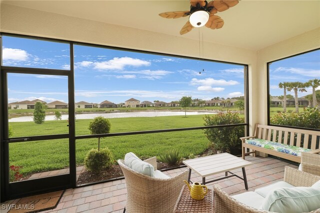 16126 Rosemallow Ln, Alva, FL 33920 - sunroom with a water view, a ceiling fan, and a residential view
