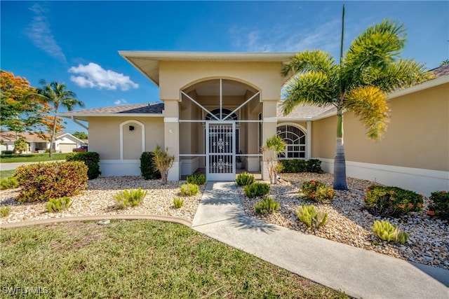 1101 SE 14th Ter, Cape Coral, FL 33990 - property entrance featuring stucco siding