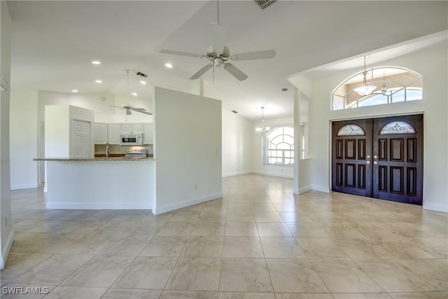 1101 SE 14th Ter, Cape Coral, FL 33990 - entrance foyer featuring ceiling fan, high vaulted ceiling, recessed lighting, and a chandelier
