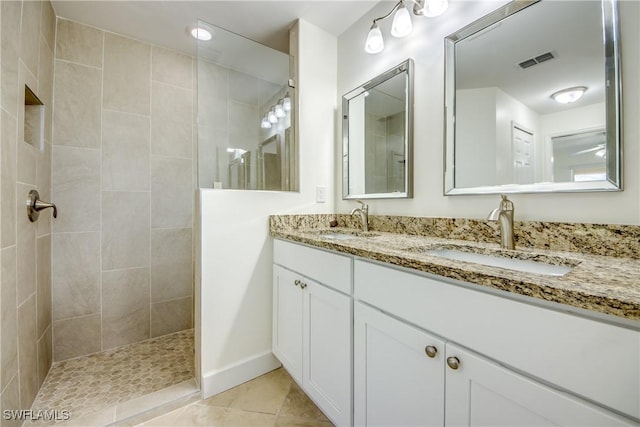 1101 SE 14th Ter, Cape Coral, FL 33990 - bathroom featuring double vanity, walk in shower, and tile patterned flooring