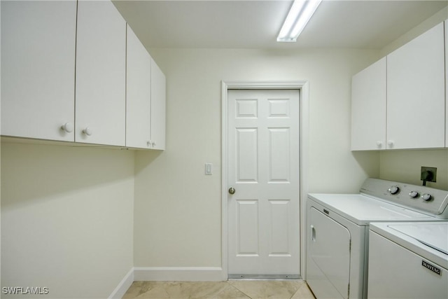 1101 SE 14th Ter, Cape Coral, FL 33990 - laundry area with cabinet space, separate washer and dryer, and light tile patterned floors