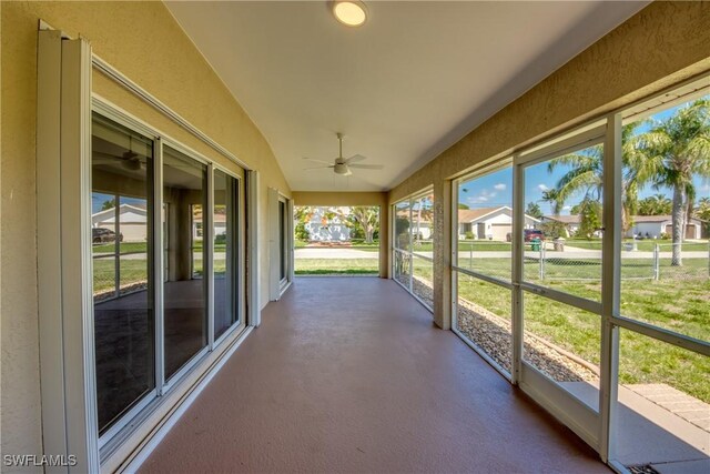 1101 SE 14th Ter, Cape Coral, FL 33990 - unfurnished sunroom featuring ceiling fan, lofted ceiling, and a residential view