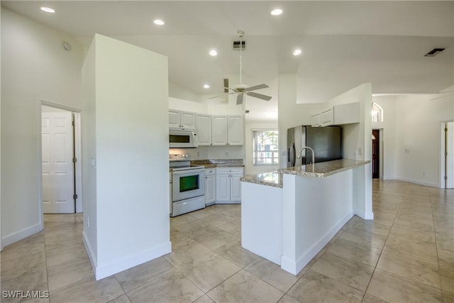 1101 SE 14th Ter, Cape Coral, FL 33990 - kitchen featuring white appliances, white cabinets, a peninsula, ceiling fan, and recessed lighting