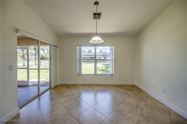 1101 SE 14th Ter, Cape Coral, FL 33990 - spare room with healthy amount of natural light, lofted ceiling, and tile patterned floors