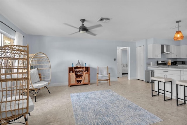 2317 El Dorado Pkwy W, Cape Coral, FL 33914 - sitting room featuring a ceiling fan and baseboards