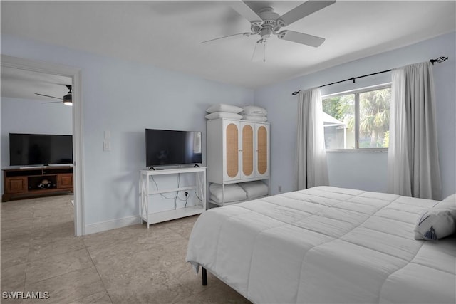 2317 El Dorado Pkwy W, Cape Coral, FL 33914 - bedroom with baseboards and ceiling fan