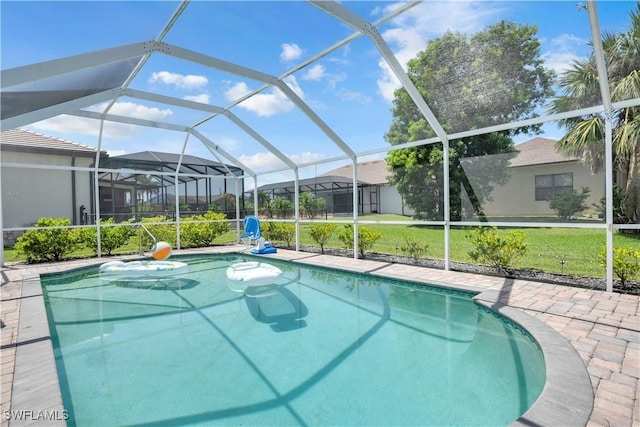 2317 El Dorado Pkwy W, Cape Coral, FL 33914 - outdoor pool featuring a lawn and glass enclosure