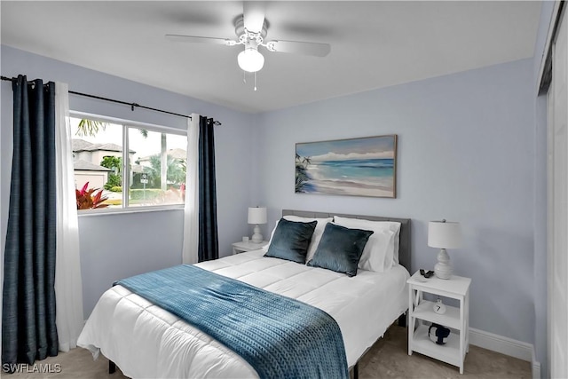 2317 El Dorado Pkwy W, Cape Coral, FL 33914 - bedroom featuring baseboards and a ceiling fan
