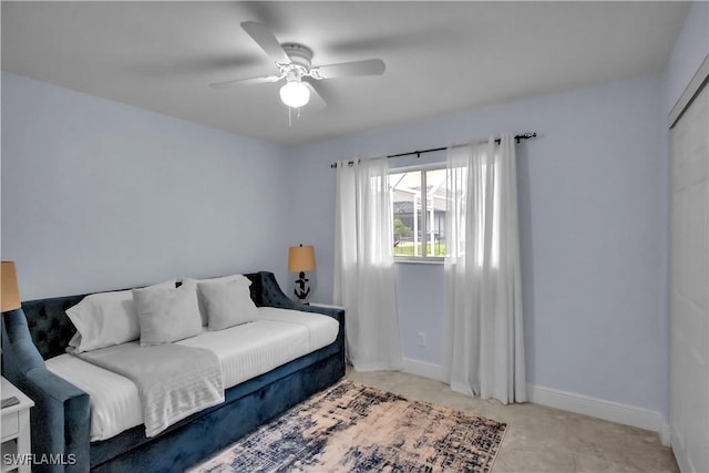 2317 El Dorado Pkwy W, Cape Coral, FL 33914 - bedroom featuring ceiling fan and baseboards