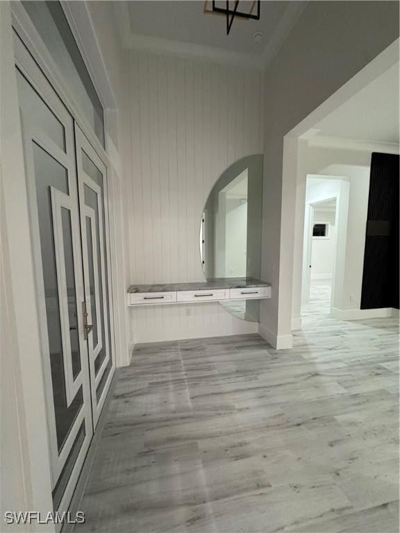 367 10th St NE, Naples, FL 34120 - corridor featuring wood finished floors, arched walkways, and wooden walls