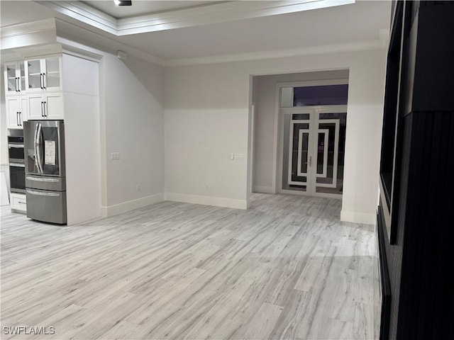 367 10th St NE, Naples, FL 34120 - kitchen with stainless steel appliances, white cabinetry, light wood finished floors, glass insert cabinets, and ornamental molding