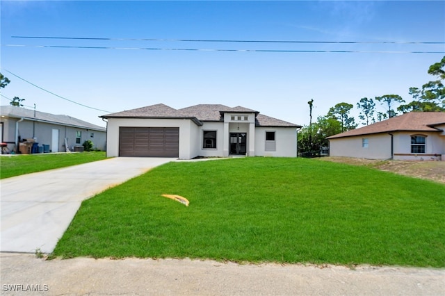 2512 10th St W, Lehigh Acres, FL 33971 - prairie-style home with a garage, concrete driveway, a front lawn, and stucco siding