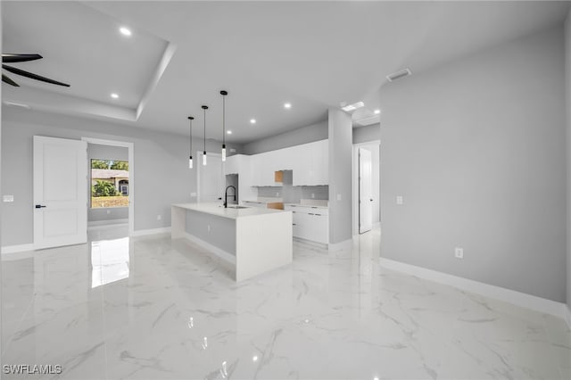 2512 10th St W, Lehigh Acres, FL 33971 - kitchen featuring a sink, baseboards, white cabinetry, light countertops, and recessed lighting
