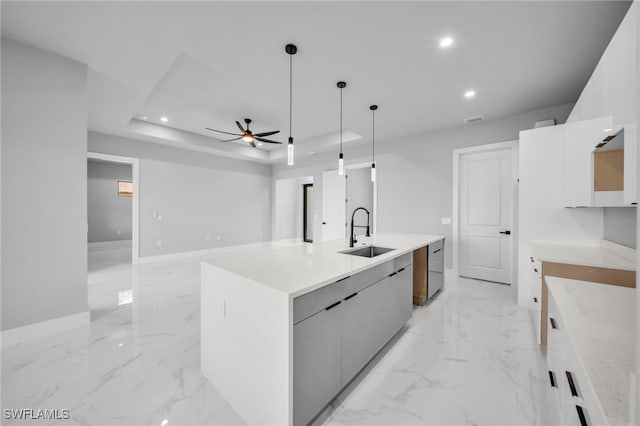 2512 10th St W, Lehigh Acres, FL 33971 - kitchen featuring modern cabinets, a sink, ceiling fan, light marble finish flooring, and recessed lighting
