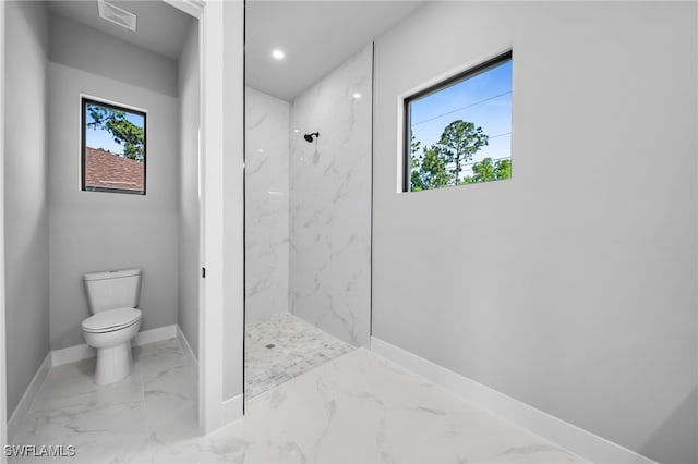 2512 10th St W, Lehigh Acres, FL 33971 - bathroom featuring a marble finish shower, marble finish floors, plenty of natural light, and recessed lighting