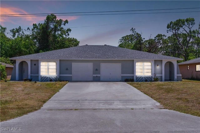 1423 SE 24th Ave, Cape Coral, FL 33990 - ranch-style house featuring stucco siding, concrete driveway, a front yard, an attached garage, and roof with shingles