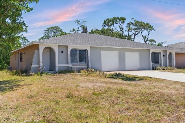 1423 SE 24th Ave, Cape Coral, FL 33990 - ranch-style house with stucco siding, a garage, concrete driveway, and a lawn