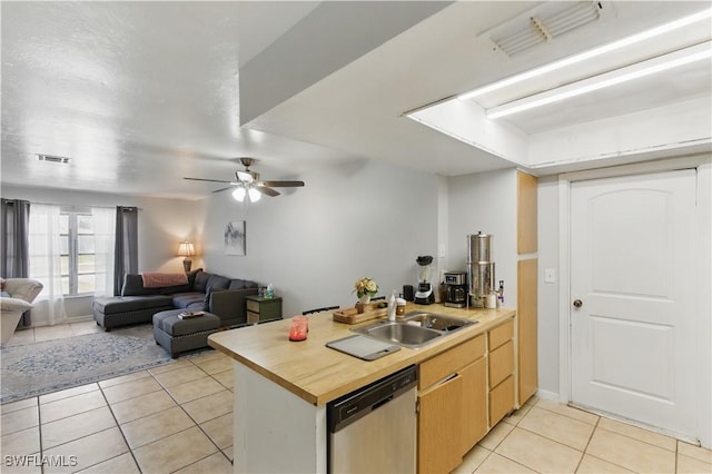 1423 SE 24th Ave, Cape Coral, FL 33990 - kitchen with stainless steel dishwasher, light tile patterned floors, a peninsula, open floor plan, and a ceiling fan