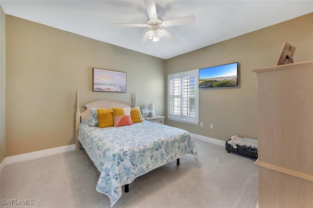 23520 Walden Center Dr Unit 207, Estero, FL 34134 - carpeted bedroom with baseboards and ceiling fan