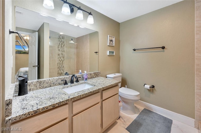 23520 Walden Center Dr Unit 207, Estero, FL 34134 - full bath featuring a tile shower, toilet, vanity, marble look tile flooring, and baseboards