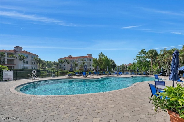23520 Walden Center Dr Unit 207, Estero, FL 34134 - community pool featuring a patio area