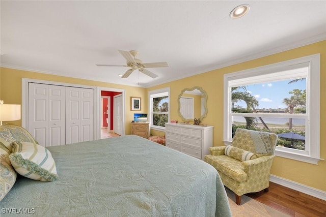 1043 Sand Castle Rd, Sanibel, FL 33957 - bedroom featuring wood finished floors, ornamental molding, and a ceiling fan