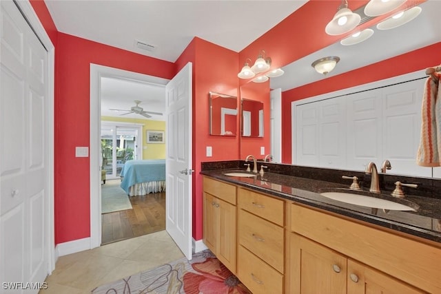 1043 Sand Castle Rd, Sanibel, FL 33957 - ensuite bathroom featuring double vanity, tile patterned floors, a closet, and a ceiling fan