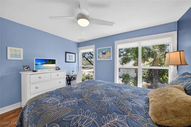 1043 Sand Castle Rd, Sanibel, FL 33957 - bedroom featuring wood finished floors and a ceiling fan