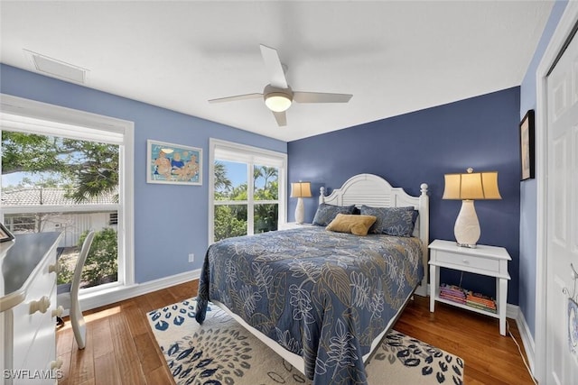 1043 Sand Castle Rd, Sanibel, FL 33957 - bedroom featuring wood finished floors and a ceiling fan