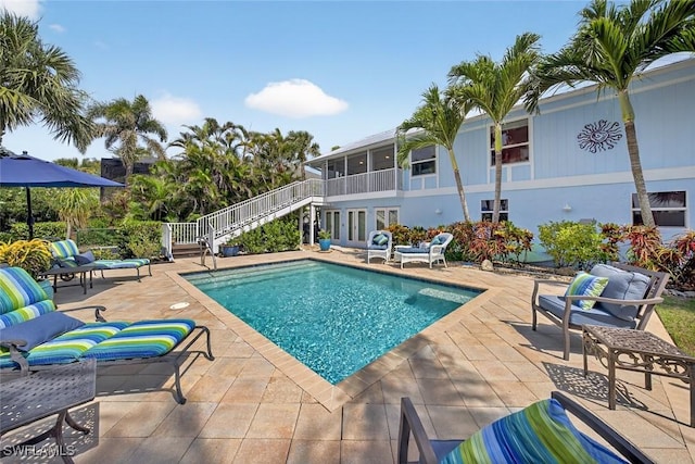 1043 Sand Castle Rd, Sanibel, FL 33957 - swimming pool featuring stairs and a patio