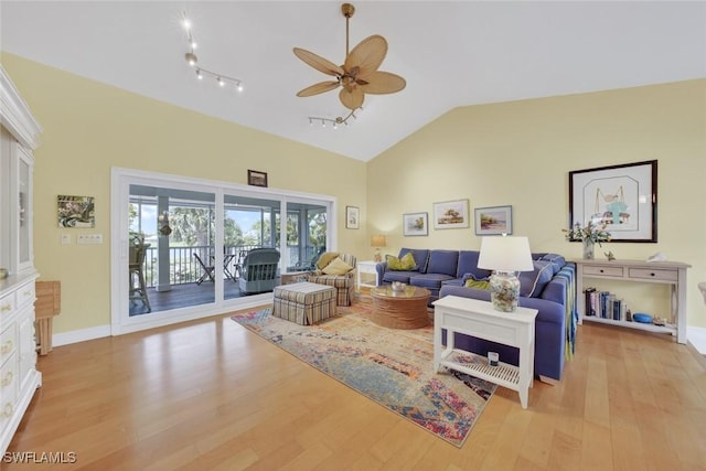 1043 Sand Castle Rd, Sanibel, FL 33957 - living area with a ceiling fan, light wood-style flooring, and high vaulted ceiling