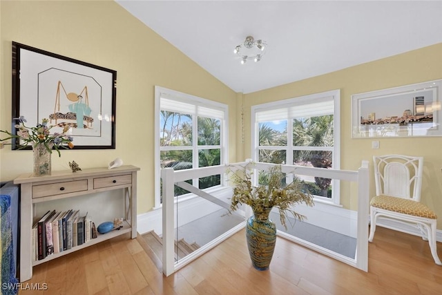 1043 Sand Castle Rd, Sanibel, FL 33957 - living area with lofted ceiling and wood finished floors
