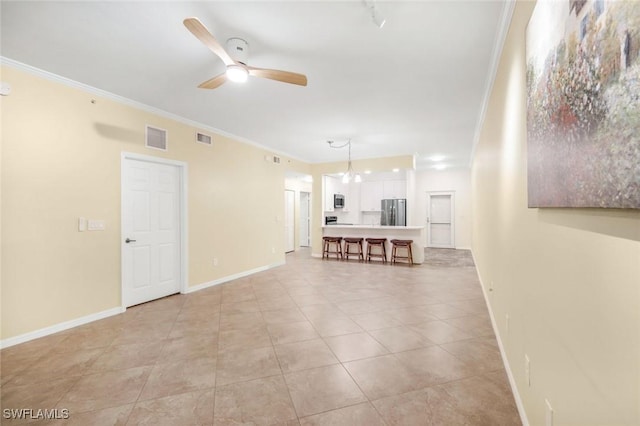 1089 Winding Pines Cir Unit 106, Cape Coral, FL 33909 - living area featuring ceiling fan, crown molding, and light tile patterned floors